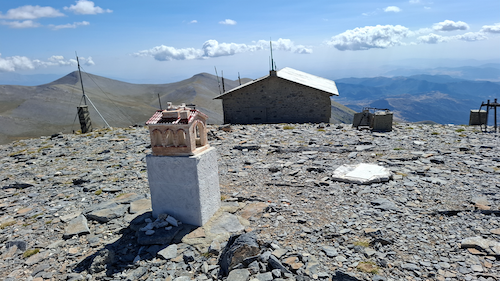 Rocky Mountain summit with metereological building.