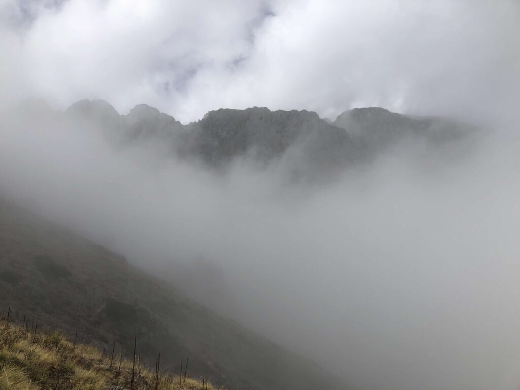 cliffs through mist