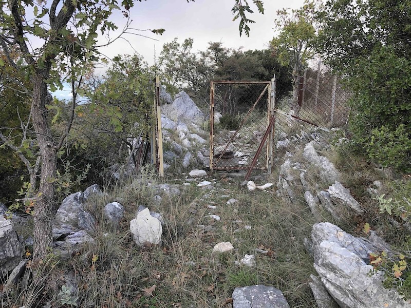 rocky hillside with gate