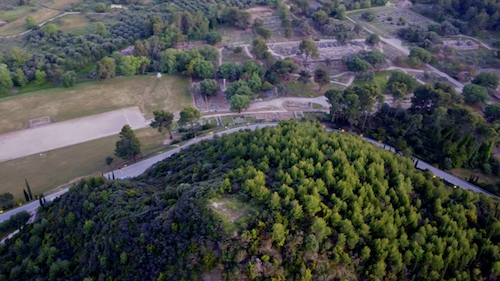 Aerial view of his top with the ancient Olympic stadium behind.